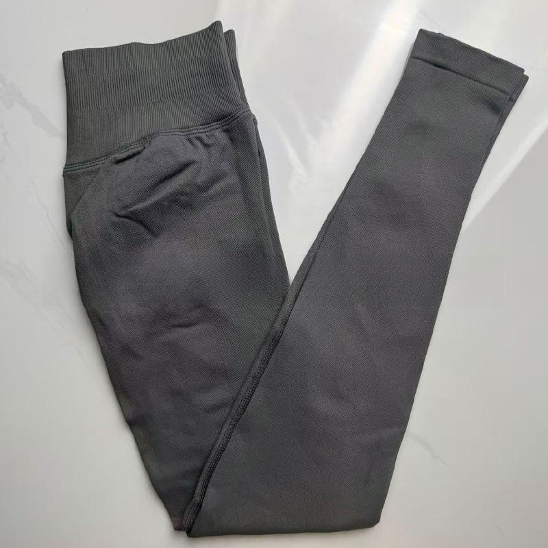 Shark grey seamless yoga leggings folded flat, showing the tall ribbed waistband