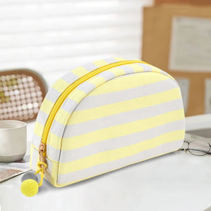 Pink green check striped toiletry bag shown closed