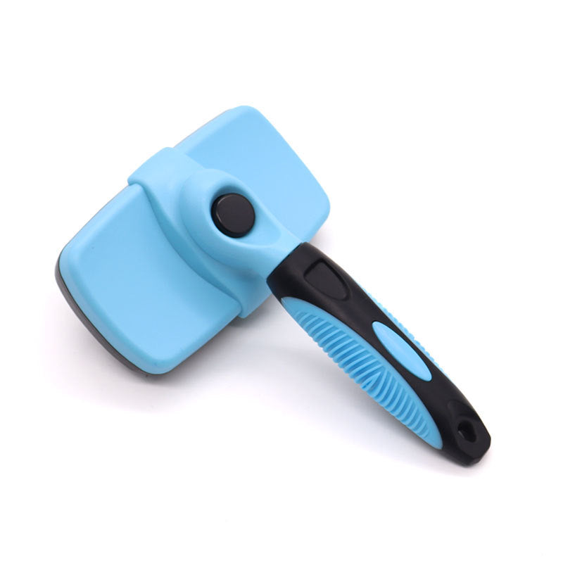 Sky blue self cleaning pet slicker brush shown from the top with the head retract button
