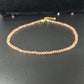 Close view of the small faceted glass beads catching the light on the strand