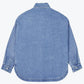 Flat back view of a washed blue denim shirt jacket with button cuffs and a rounded curved hem