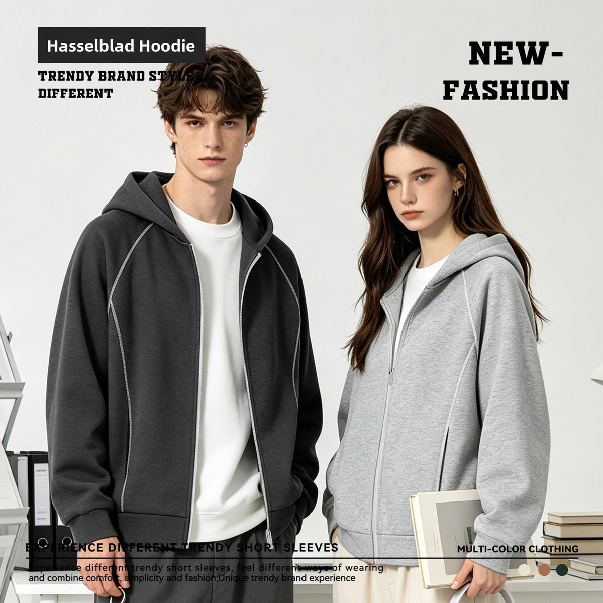 Man in a dark grey zip hoodie and woman in a heather grey zip hoodie, worn with white tees in a studio