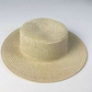 Beige woven paper straw sun hat with a flat top crown and a wide even brim