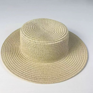 Beige woven paper straw sun hat with a flat top crown and a wide even brim
