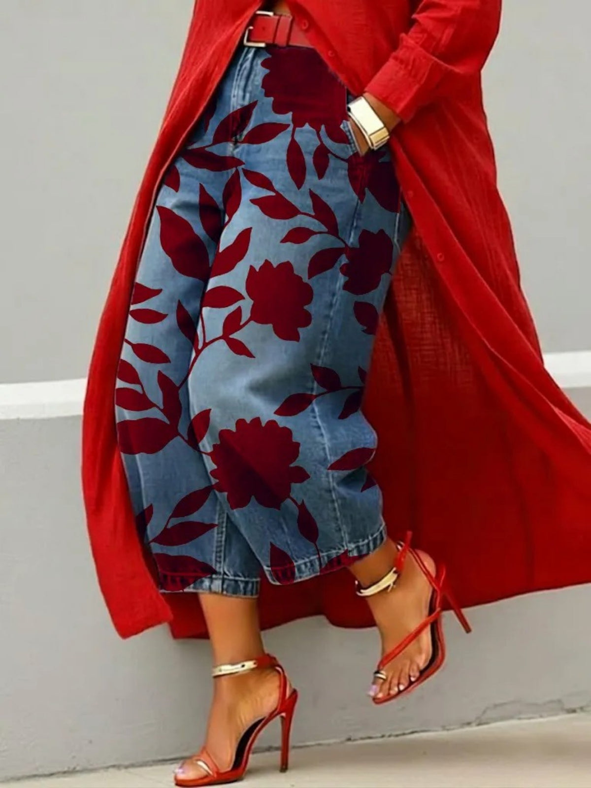 Wide leg cropped denim jeans with burgundy leaf and bloom print on light blue denim, red coat and heels