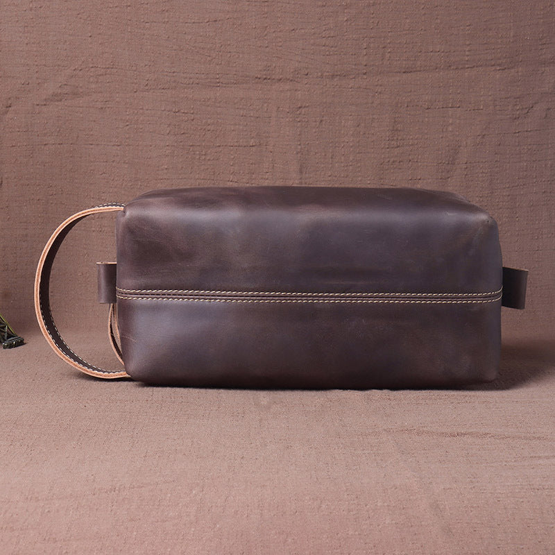 Dark brown distressed cowhide dopp kit side profile with grab handle