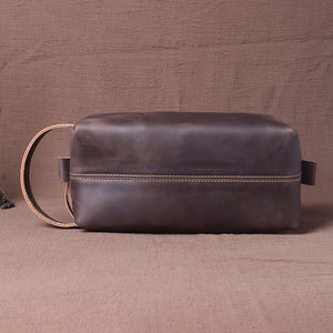 Cowhide leather handbag side profile with strap detail