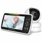 Baby monitor with a black bezel screen and a color indicator bar beside a round white camera, a baby asleep on screen