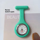 Orange silicone nurse fob watch with a round analog dial and inner seconds ring