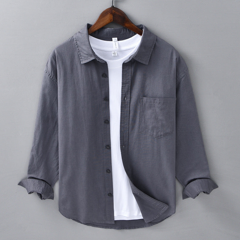 Detail of the neat flat stitching around the collar of the linen blend shirt