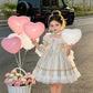 Apricot ball gown dress styled with dressy shoes for a party look