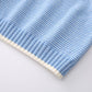Close up of the knit blend yarn and horizontal stripe texture on the blue sweater