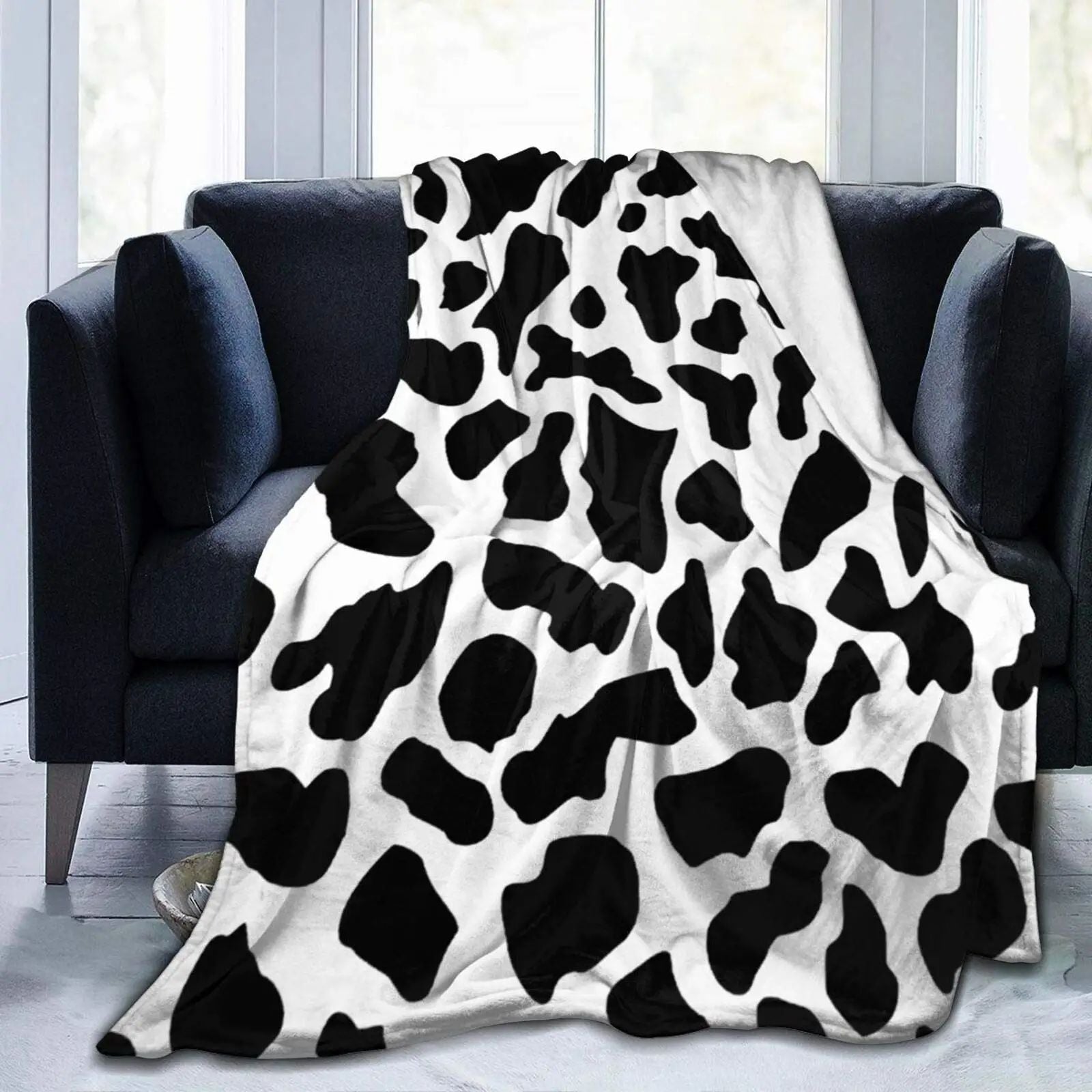 Blanket draped on the back seat of a car for a road trip