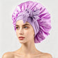 Satin sleep bonnet with a wide stretch band and long tie straps knotted into a bow