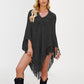 Openwork diamond eyelet knit poncho with a folded collar and long knotted tassel fringe
