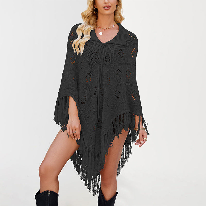 Openwork diamond eyelet knit poncho with a folded collar and long knotted tassel fringe