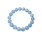 Single strand of milky blue aquamarine beads formed into a round stretch bracelet on white