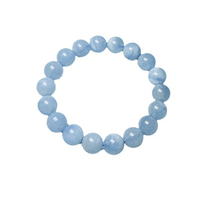 Single strand of milky blue aquamarine beads formed into a round stretch bracelet on white