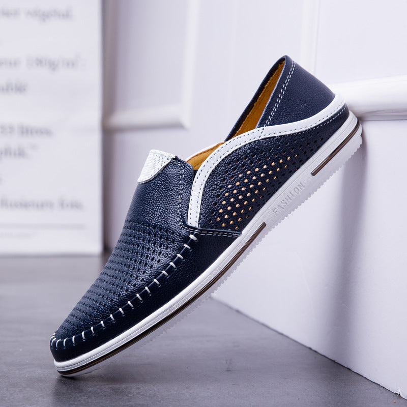 Leather cutout loafer with breathable perforations across the upper on a low wedge sole