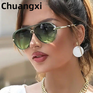 Retro large frame sunglasses worn outdoors on a sunny day