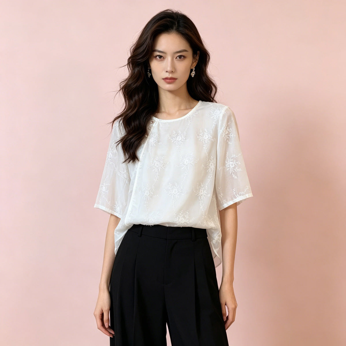 White embroidered short sleeve shirt styled with black tailored trousers