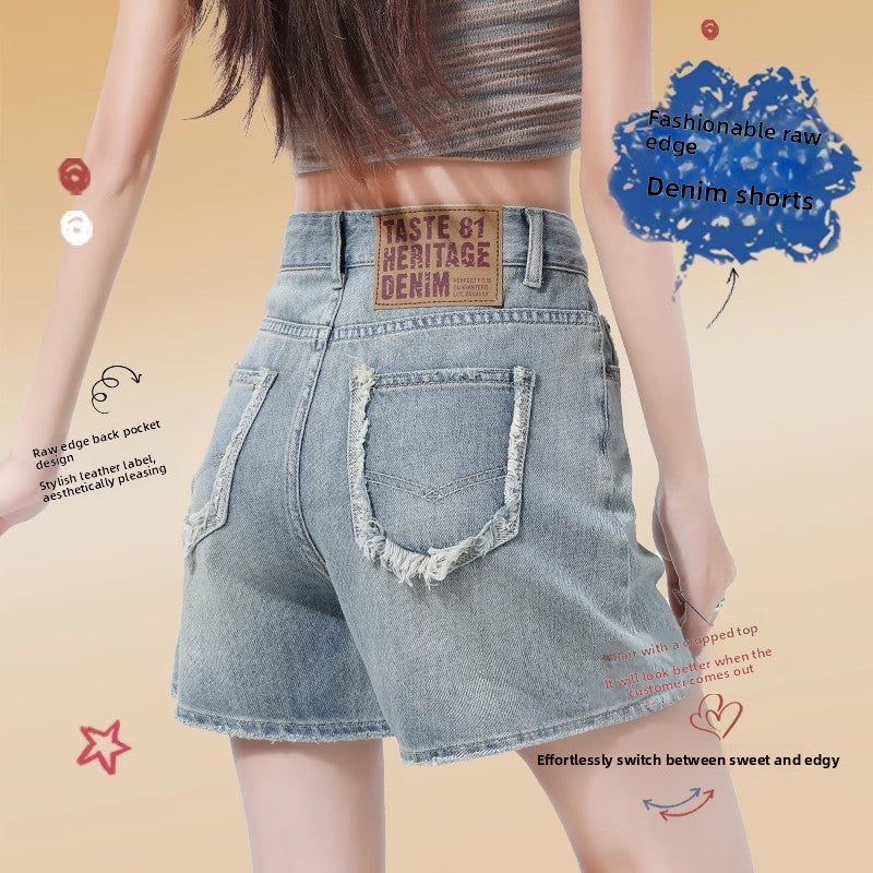 Front styling of high-waisted denim shorts worn with a cropped knit top