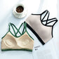 Green trimmed cream bra top showing its inner cup pads beside a beige bra top with black trim, flat lay
