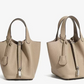 Leather bucket tote bag side profile showing the shoulder strap