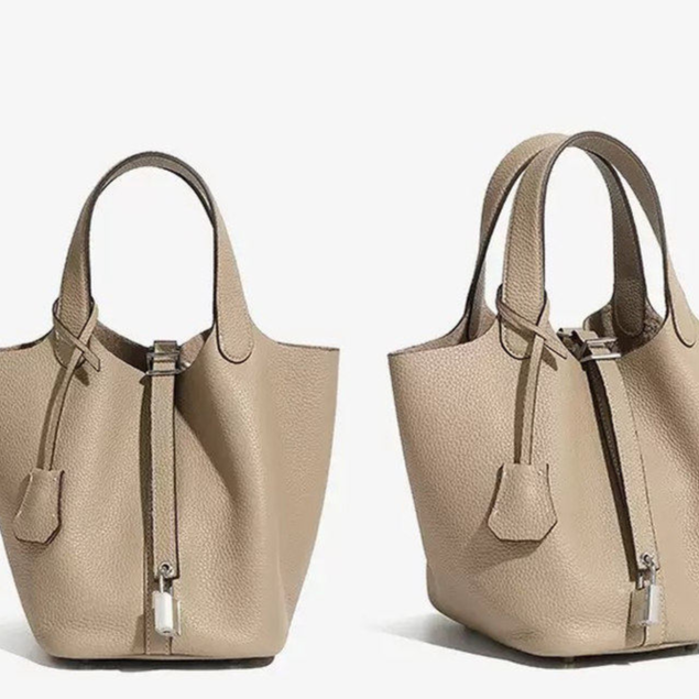 Leather bucket tote bag side profile showing the shoulder strap