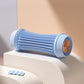 Foot massage roller styled in a calm neutral setting on a plain surface