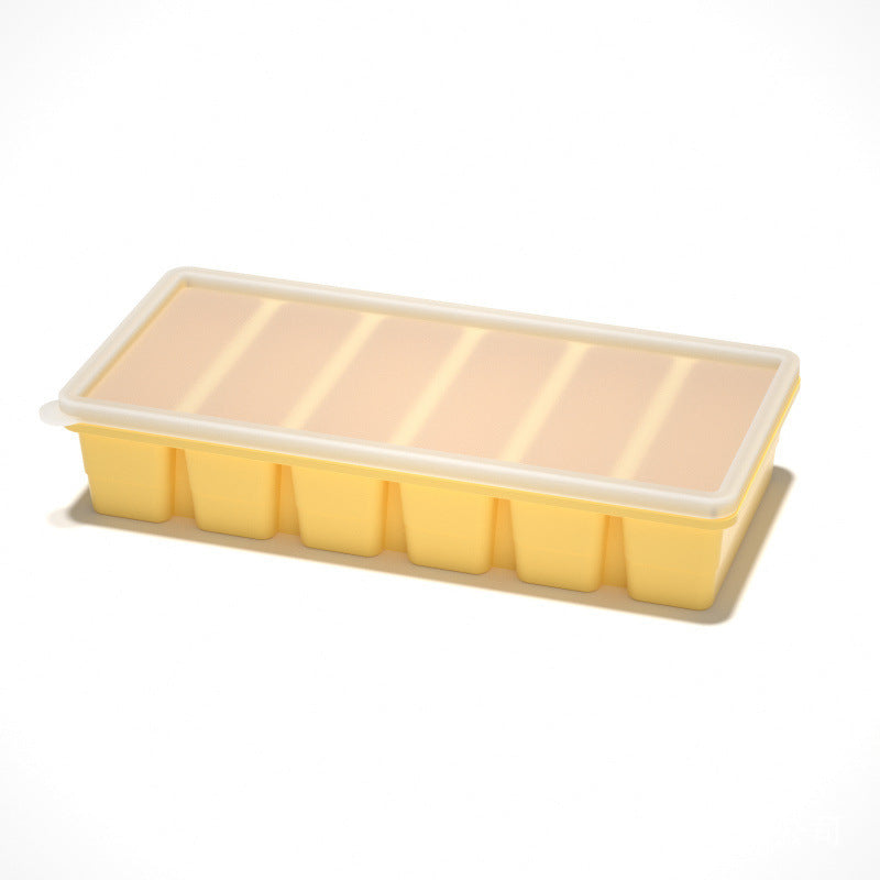 Flexible platinum silicone ice cube tray with the lid lifted off for freezing ice cubes
