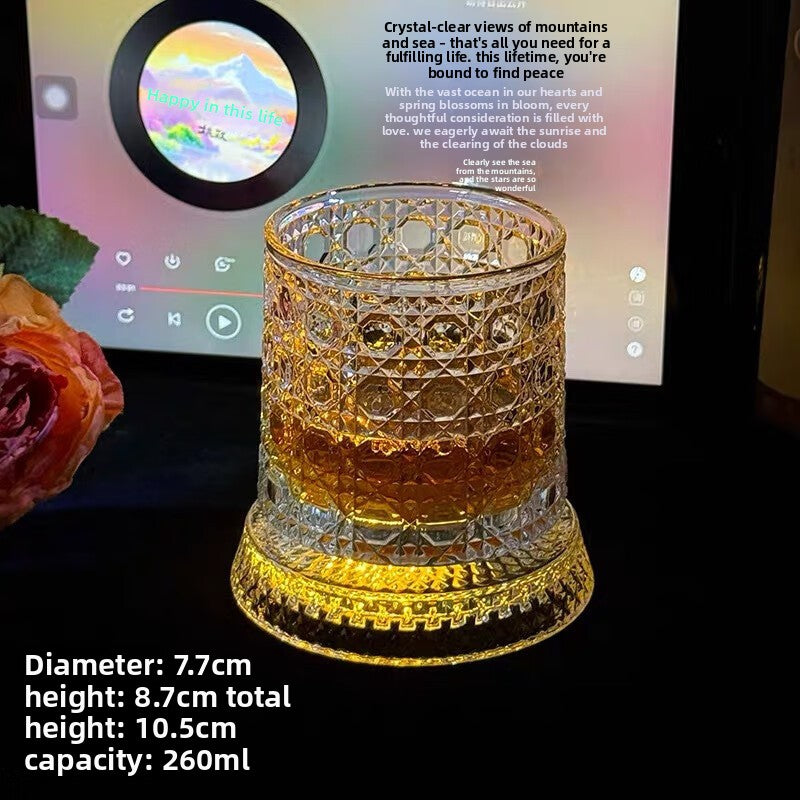 Lit whiskey tumbler beside a rose with the maker size panel, 8.7 cm and 260 ml