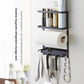 Black iron magnetic storage rack on a fridge side with a paper towel bar and utensil hooks