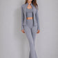 Zip jacket open over the cropped bra, showing shaped seams through the body