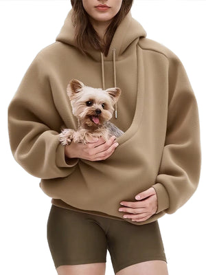 Pink plush fleece hooded sweatshirt with a large front pet pouch shown on a model
