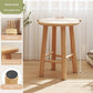Log wood stool used by an entryway to sit and put on or take off shoes