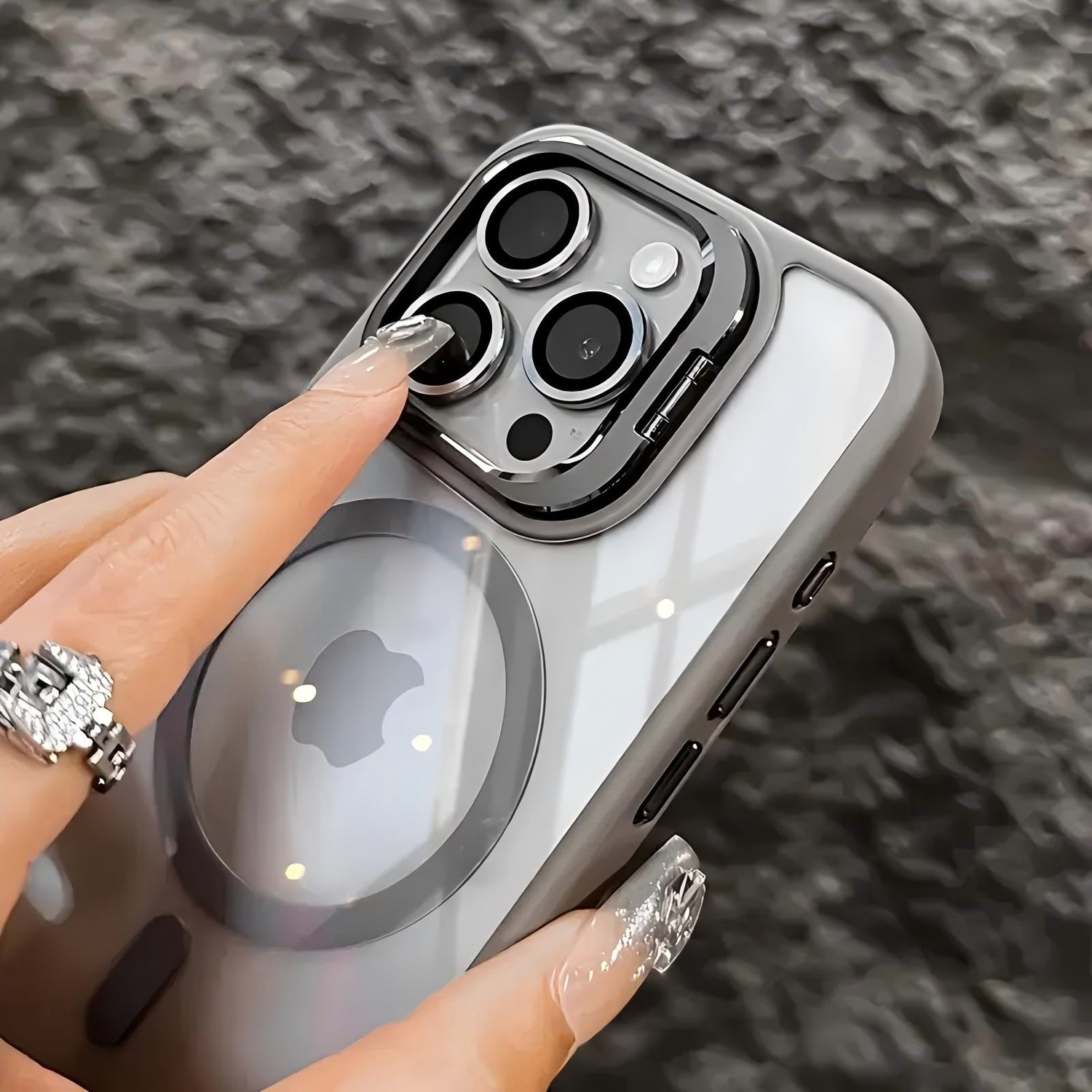 Magnetic protective translucent phone case with a fold out camera stand compatible with iPhone