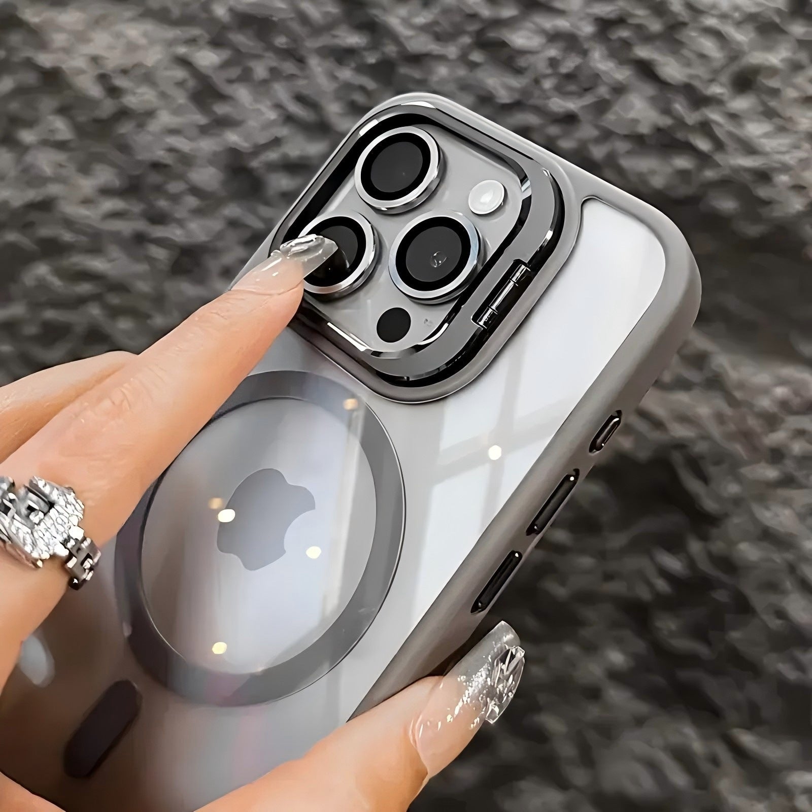 Magnetic protective translucent phone case with a fold out camera stand compatible with iPhone