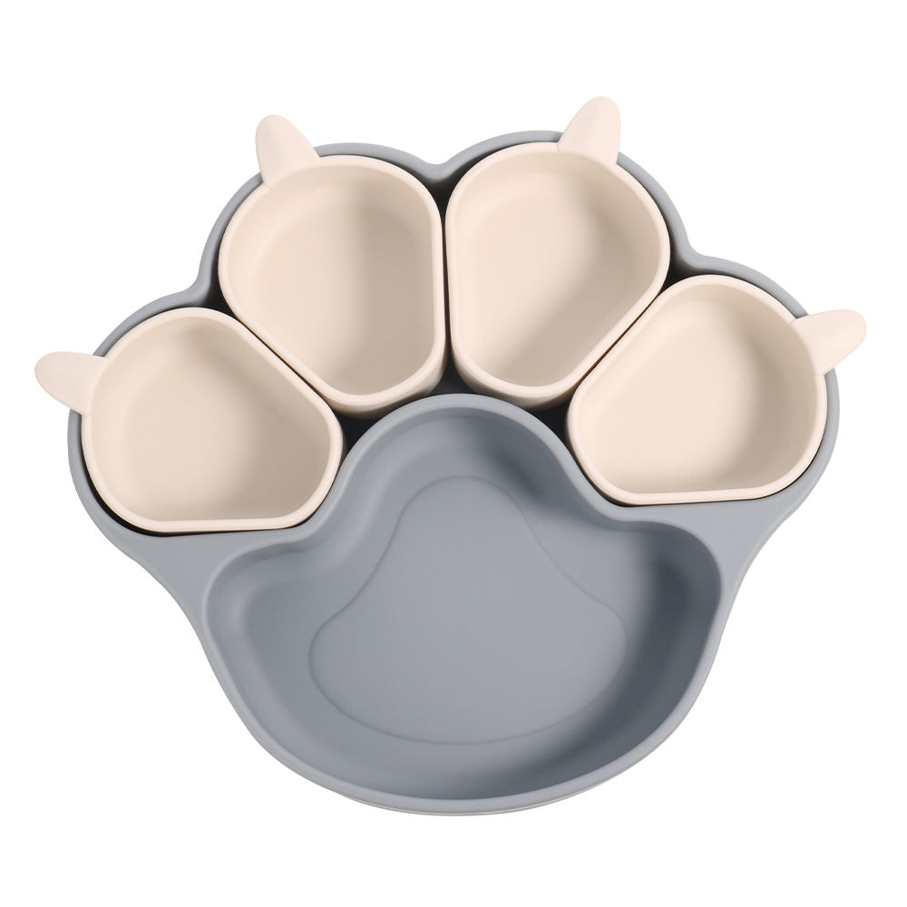 Dark blue gray bear paw plate with four small cream cups on a white background