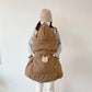 Rabbit face embroidered on the front pocket of the quilted baby cape