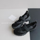 Black platform slip-on shoes with a wide strap, elastic cords and a black lug sole, EU size 41 option