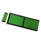 Black and green spiked massage mat with matching spiked head pillow, top view on a white background