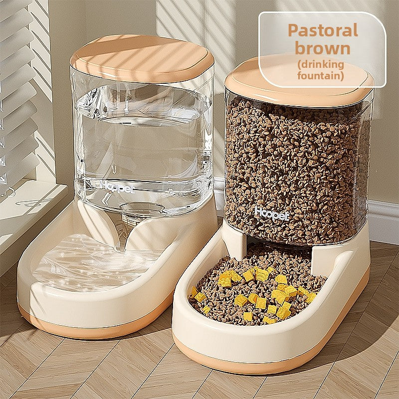 Pink gravity pet feeder with a clear kibble reservoir over a bowl