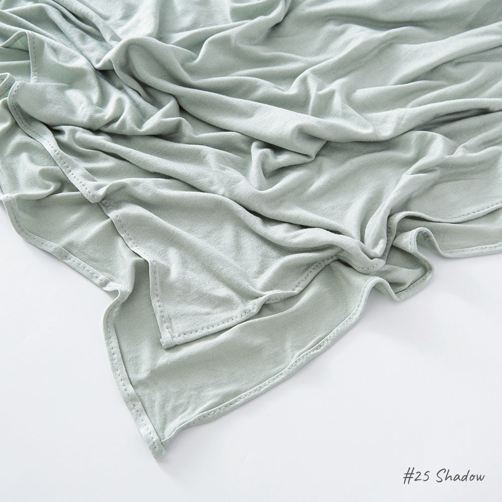 Modal cotton headscarf wrap with a narrow rolled hem running along the finished rectangular edge