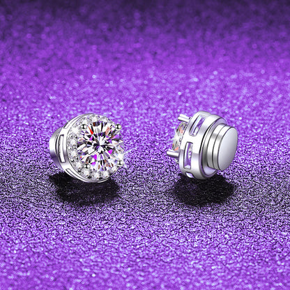 Pair of silver halo stud earrings on purple glitter, one showing the stone front and one the flat magnetic back