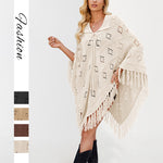 Draped knit poncho with openwork eyelet stitch, collar front tie and tassel fringe hem
