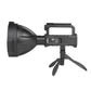 Side view of black LED searchlight showing recessed USB charging port and battery level lights