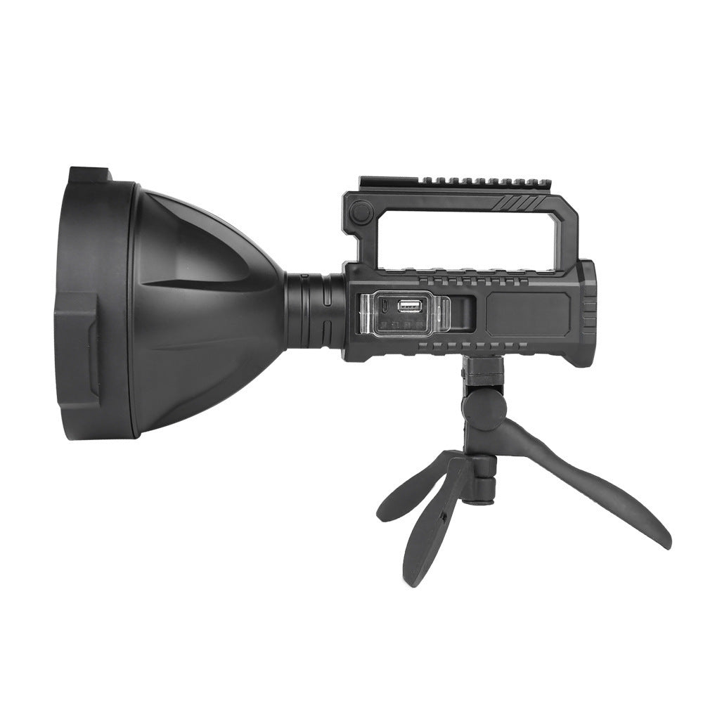 Side view of black LED searchlight showing recessed USB charging port and battery level lights