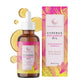 Sixty millilitre amber body oil bottle with white dropper cap shown beside its tropical print box