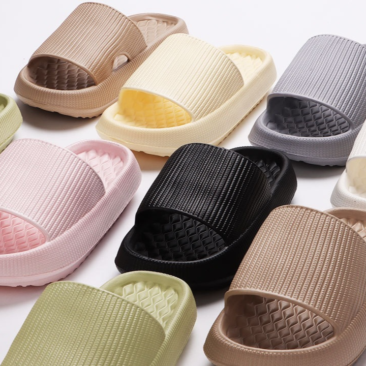 Front view of closed toe cotton slipper with rubber sole